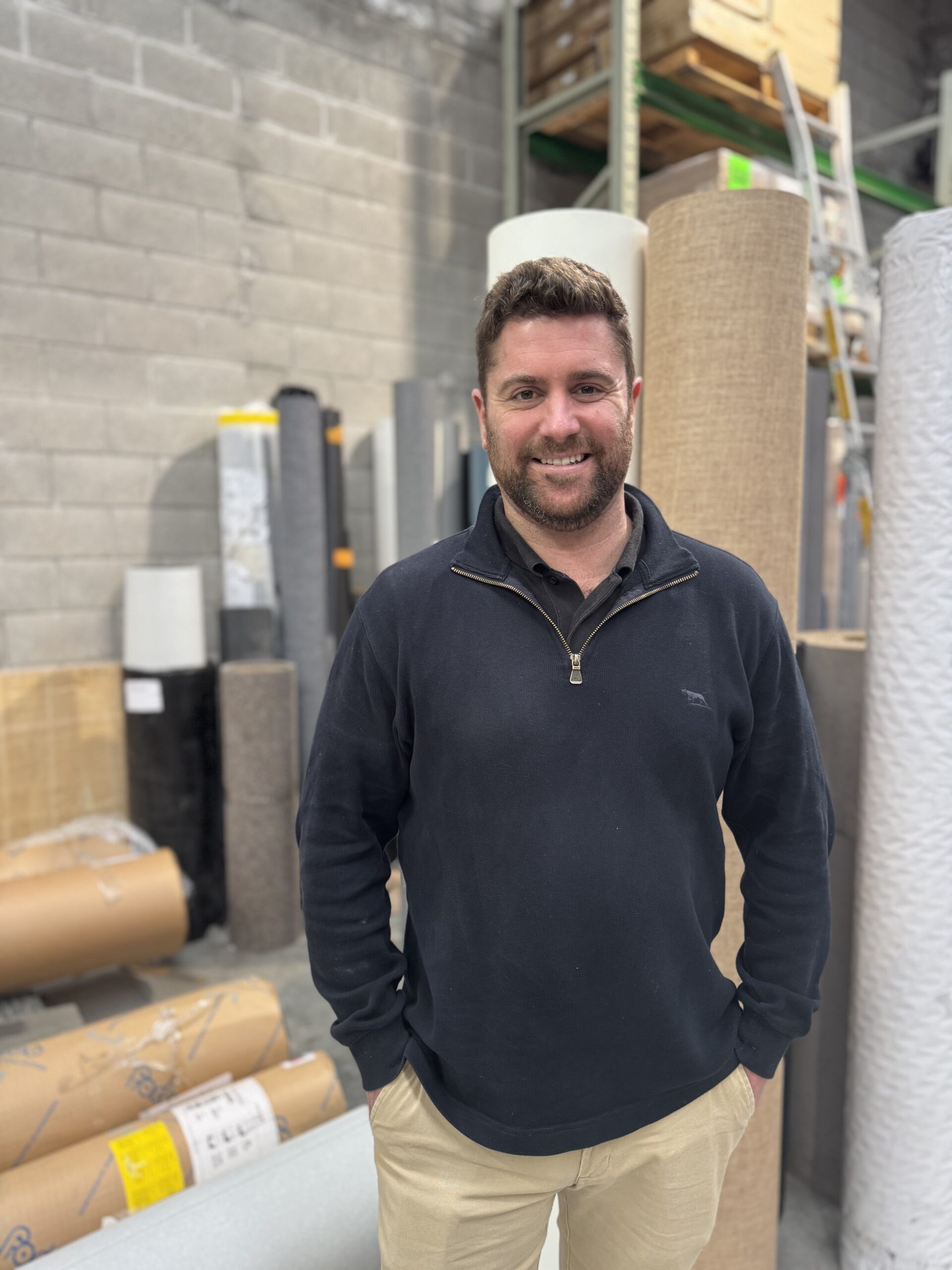 Director of Tinakori Flooring standing in a warehouse